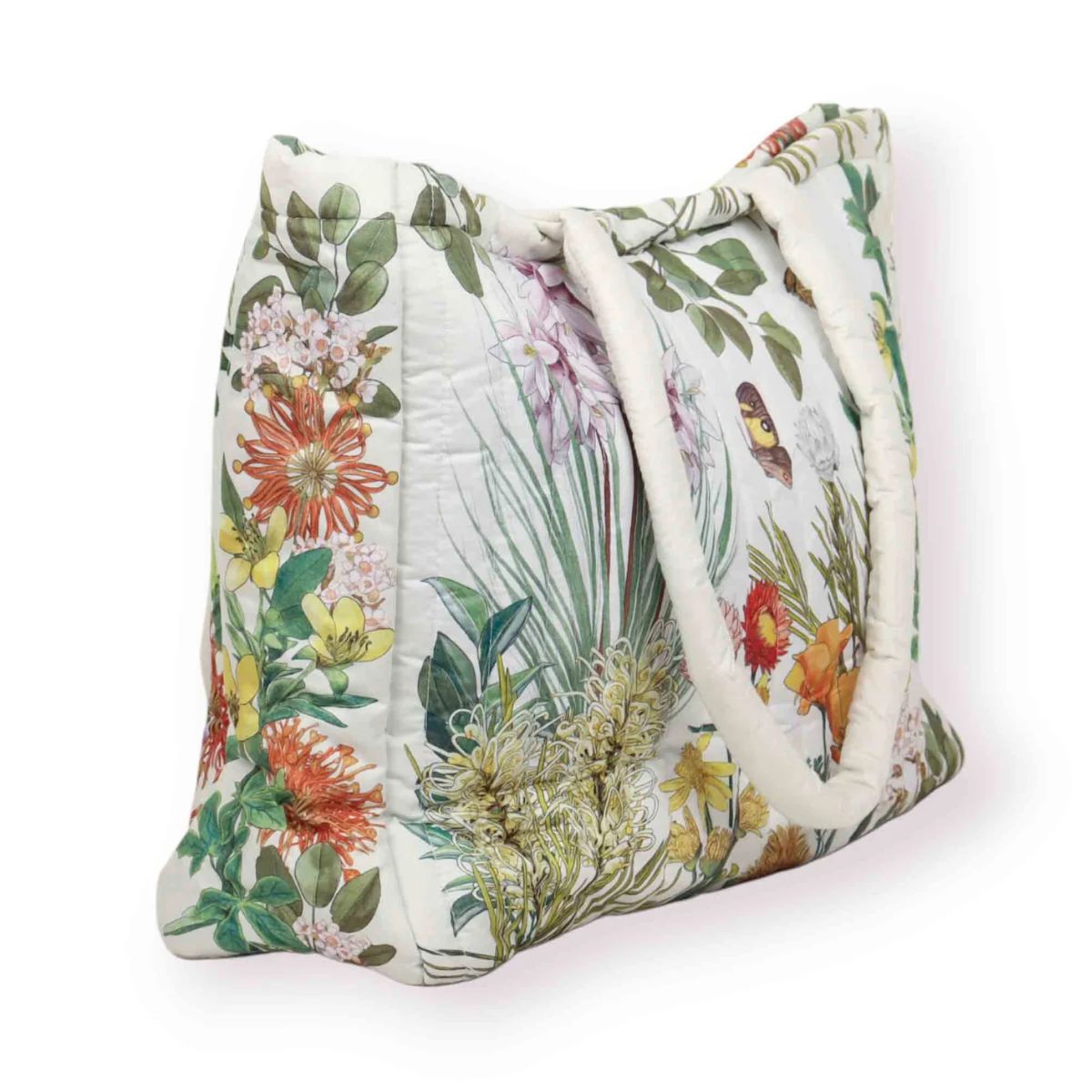 Floral patterned bag with white handles on a white background