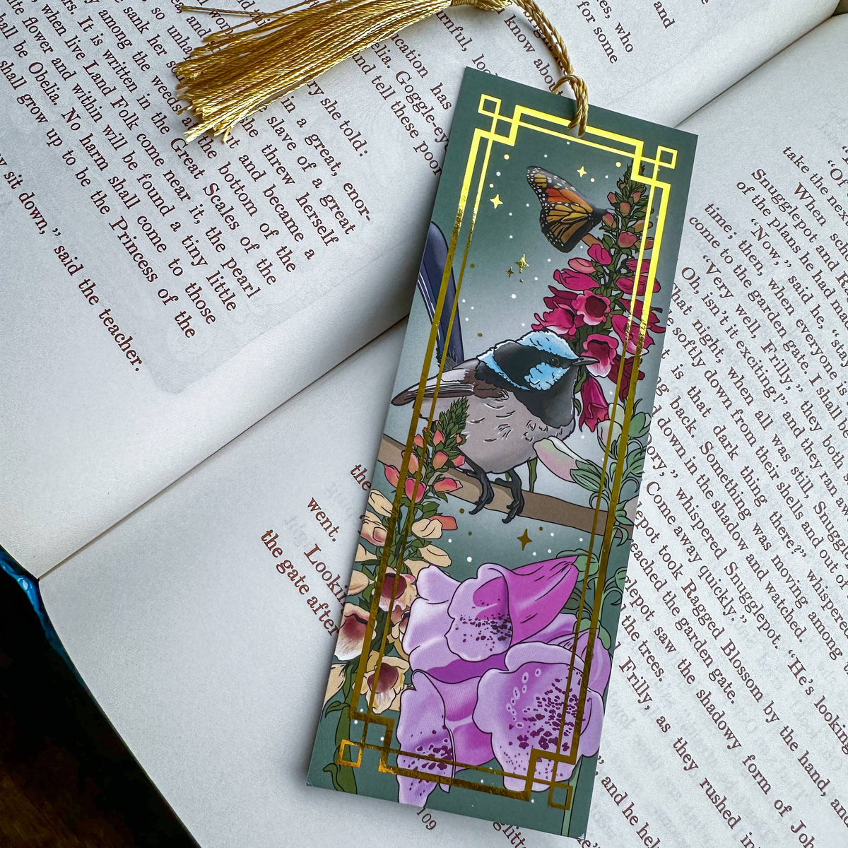 Decorative bookmark with a native Australian bird fiary wren and flower design on an open book